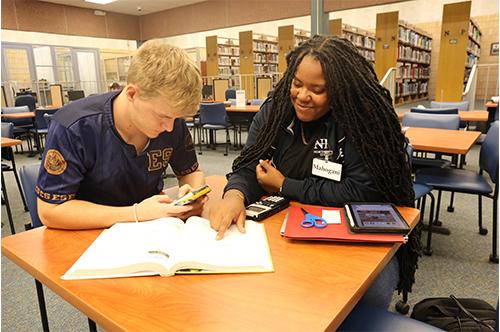 Mahogani Hawkins, Peer Tutor, and Mason Good with calculators