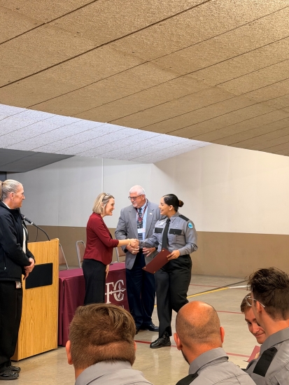 Class leader Lilyann Matos receives her certificate from NFC President Dr. Jennifer Page