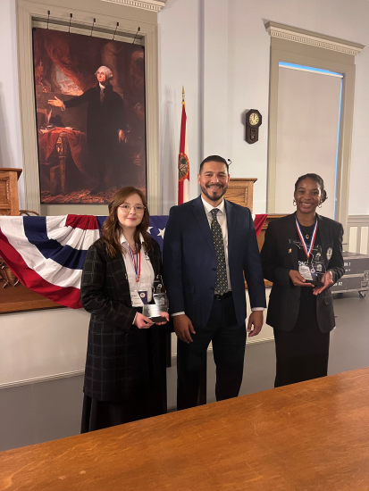 NFC Student Lillian Clay (left) won first place award at the Sunshine State Debate Finals.