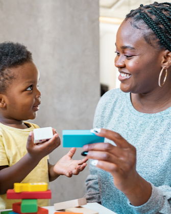 Student teaching a child